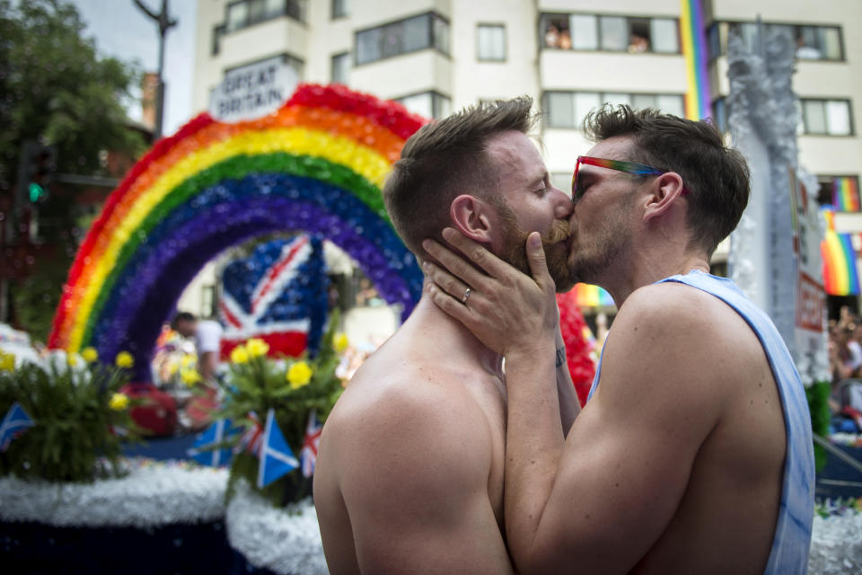 A couple kissed after getting engaged during the Capital Pride Parade in Washington on Saturday June 8, 2019. (Photo: Caroline Brehman/CQ Roll Call)