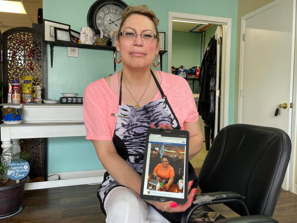 Chris Blanco , sitting in her Galesburg hair salon at 975 N. Henderson St., holds a picture of her best friend from Uvalde, Texas, Naomi Mason. Blanco said the two were inseparable after they met in 8th grade.