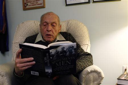 Harry Ettlinger reads a book at his home at Rockaway in New Jersey, November 20, 2013. REUTERS/Eduardo Munoz
