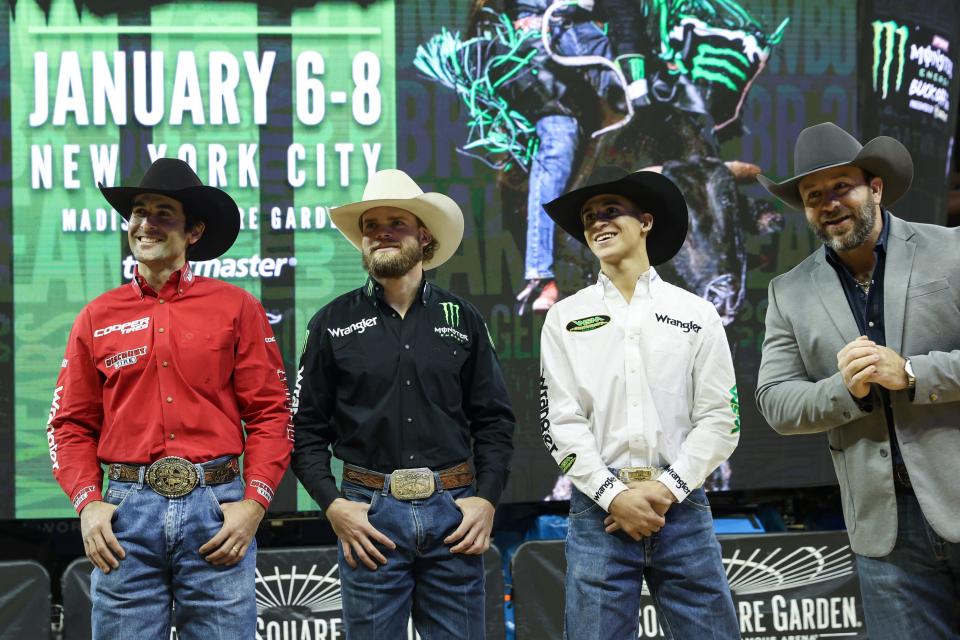 PBR announcer Matt West, right speaks with Silvano Alves, Dalton Kasel, and Boudreaux Campbell at Madison Square Garden on Jan. 5.