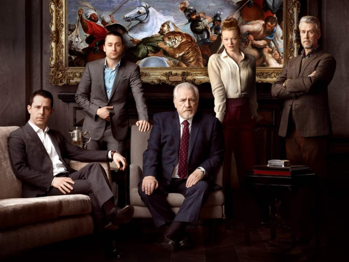 The characters of HBO's Succession, with patriarch Logan Roy, played by Brian Cox, surrounded by his children. The show's modest popularity begs the question: why do we love these wealthy jerks? (HBO - image credit)