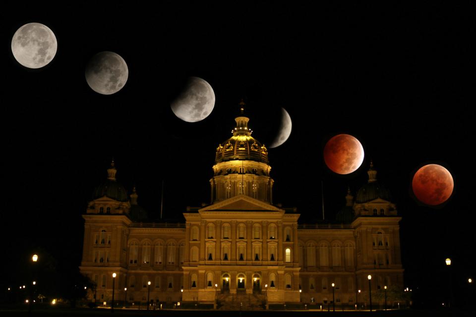 A composite view of a lunar eclipse over the Iowa Capitol early on Oct, 8, 2014.