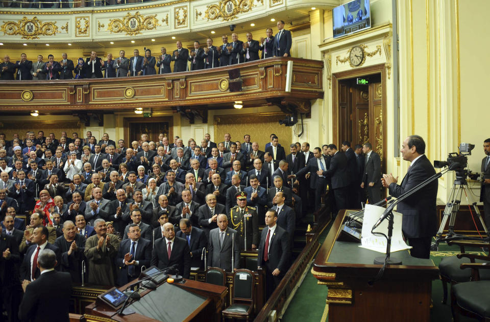 FILE - In this Feb. 13, 2016 file photo provided by Egypt's state news agency MENA, Egyptian President Abdel-Fattah el-Sissi, addresses parliament in Cairo, Egypt. On Monday Feb. 10, 2020, the state-run news agency said Egypt’s legislature gave its initial approval for toughening up already draconian anti-terrorism laws, with amendments that include life sentences and capital punishment for funding terrorism. (MENA via AP, File)