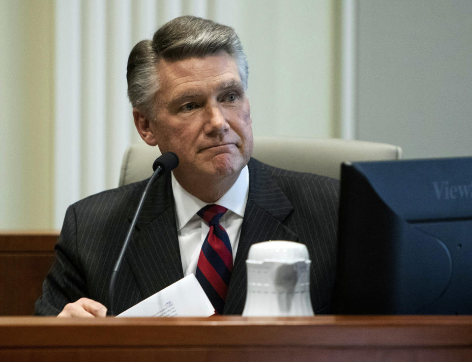 Mark Harris, Republican candidate in North Carolina's 9th congressional race, makes a statement before the state board of elections calling for a new election during the fourth day of a public evidentiary hearing on the 9th congressional district voting irregularities investigation Thursday, Feb. 21, 2019, at the North Carolina State Bar in Raleigh, N.C. (Travis Long/The News & Observer via AP, Pool)