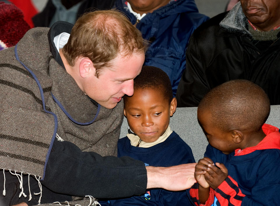 Prince William chats to children as he and Prince Harry visit Semongkong Children's Centre in Lesotho.