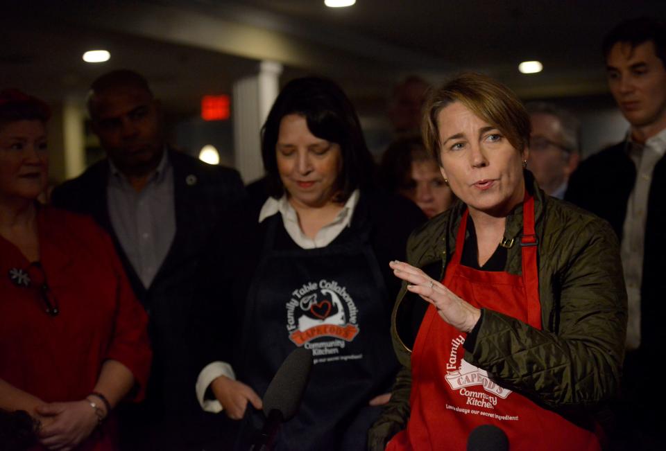 Gov.-elect Maura Healey talks with the media with Lt. Gov.-elect Kim Driscoll, center, during their visit to the Family Table Collaborative in South Yarmouth.