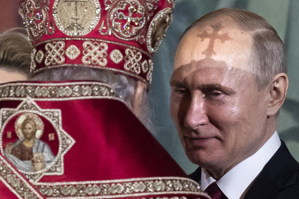 FILE - In this April 28, 2019, file photo, President Vladimir Putin, right, listens to Russian Orthodox Patriarch Kirill, back to a camera, during the Easter service in the Christ the Savior Cathedral in Moscow, Russia. Putin is just a step away from bringing about the constitutional changes that would allow him to extend his rule until 2036. The vote that would reset the clock on Putin’s tenure in office and allow him to serve two more six-year terms is set to wrap up Wednesday, July 1, 2020. (AP Photo/Alexander Zemlianichenko, File)