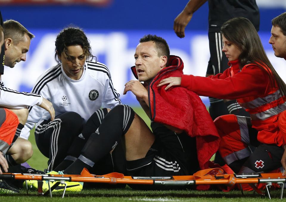 Chelsea's John Terry is placed on a stretcher after taking a knock during the Champions League semifinal first leg soccer match between Atletico Madrid and Chelsea at the Vicente Calderon stadium in Madrid, Spain, Tuesday, April 22, 2014. (AP Photo/Andres Kudacki)