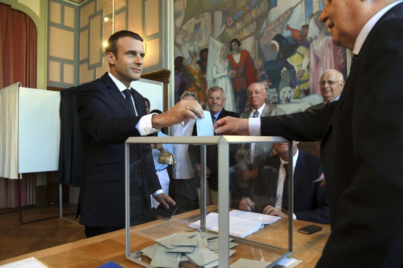 法國國民議會第2輪投票登場，法國總統馬克宏投下神聖一票（AP）