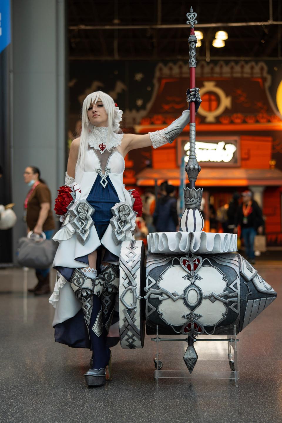 A cosplayer dressed as Snow White from "SINoALICE" at New York Comic Con 2022.