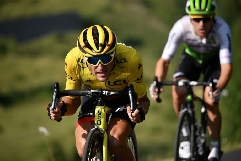 Belgium's Greg Van Avermaet (L) on his way to retaining the race leader's yellow jersey during the Tour de France 10th stage