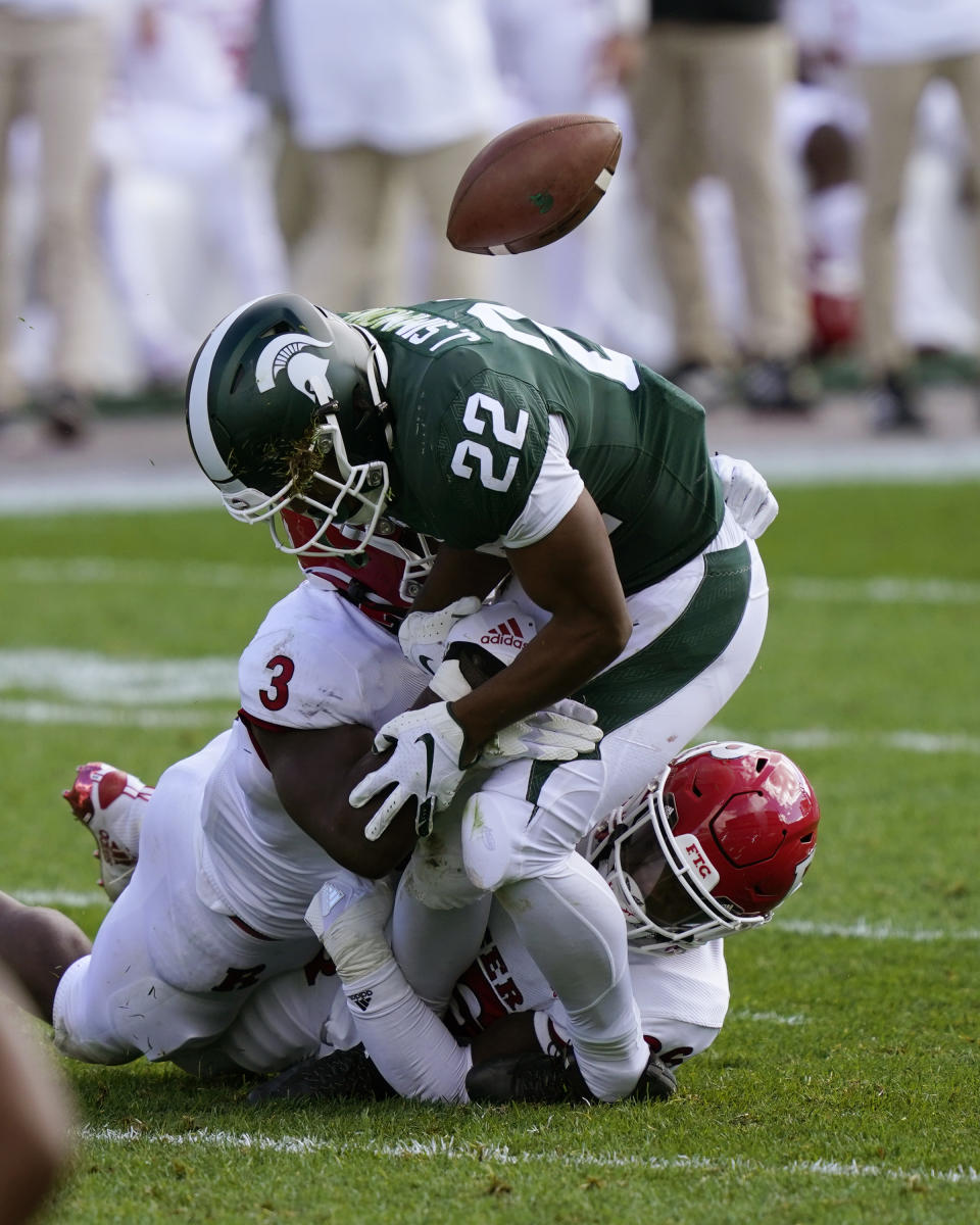 Rutgers linebacker Olakunle Fatukasi (3) knocks the ball away from Michigan State running back Jordan Simmons (22) during the second half of an NCAA college football game, Saturday, Oct. 24, 2020, in East Lansing, Mich. (AP Photo/Carlos Osorio)