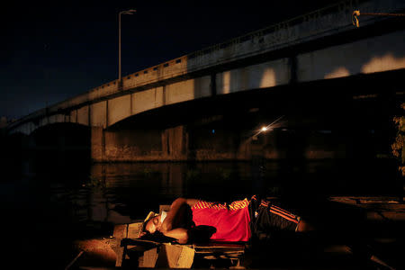 A man sleeps in the open in Tondo, Manila, Philippines early October 24, 2016. Local residents from the neighbourhood in Manila's slum of Tondo in which several people were killed in drugs related operations, say there are more people sleeping outside their homes since the beginning of the country's war on drugs fearing for their safety. REUTERS/Damir Sagolj