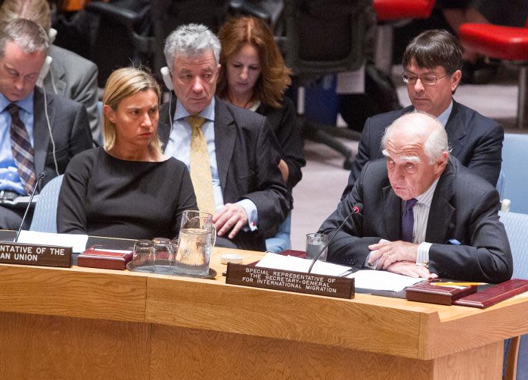 Peter Sutherland (front R), Special Representative of the Secretary-General on International Migration and Development, addresses a UN Security Council meeting on May 11, 2015 as EU foreign policy chief Federica Mogherini (L) listens