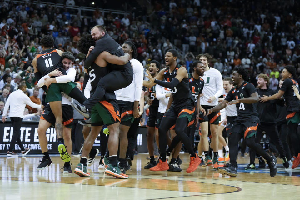 Miami celebrates after their win against Texas in an Elite 8 college basketball game in the Midwest Regional of the NCAA Tournament Sunday, March 26, 2023, in Kansas City, Mo (AP Photo/Jeff Roberson)