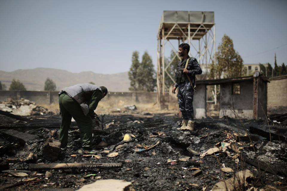 FILE - Yemeni police inspect a site of Saudi-led airstrikes targeting two houses in Sanaa, Yemen, March 26, 2022. A new report says there’s no sign that the Pentagon or State Department has ever investigated whether U.S. military aid was used in Saudi or Emirati strikes alleged to have killed civilians in Yemen. The General Accounting Office released the report Wednesday. (AP Photo/Hani Mohammed, File)