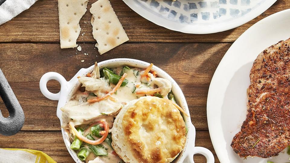 stovetop chicken pot pie served in individual bowls with a biscuit on top