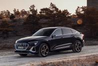 <p>Audi is following the form factor of "coupe-SUVs" such as the BMW X6 by creating a swoopier version of its <a href="https://www.caranddriver.com/news/a29851281/audi-e-tron-sportback-2020-photos-info/" rel="nofollow noopener" target="_blank" data-ylk="slk:e-tron electric SUV;elm:context_link;itc:0;sec:content-canvas" class="link ">e-tron electric SUV</a>. The only real difference between the Sportback and the standard e-tron is the more sharply sloped roofline in the rear. The electric motors and 95.0-kWh battery pack are identical, meaning the Sportback should provide a nearly identical 204-mile estimated driving range on the EPA's test cycle. - <em>Joey Capparella </em></p>