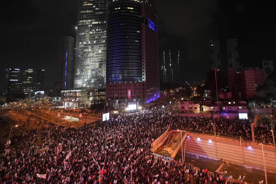 Israelis protest against the plans by Prime Minister Benjamin Netanyahu's new government to overhaul the judicial system, in Tel Aviv, Israel, Saturday, Jan. 28, 2023. (AP Photo/Tsafrir Abayov)