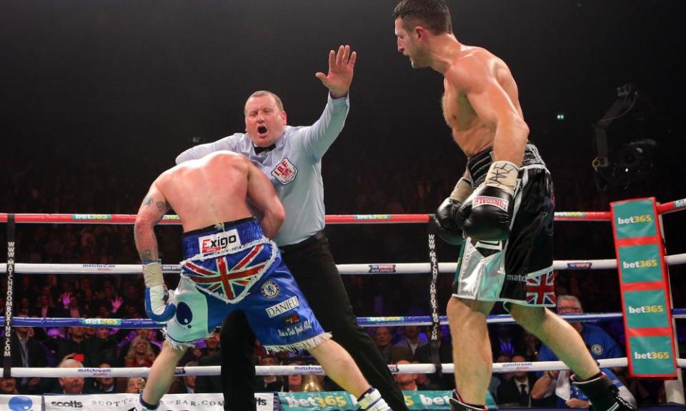 Referee Howard Foster grabs George Groves and controversially ends the fight one minute and 32 seconds into the ninth round