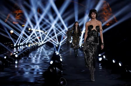 Saint Laurent brings elegance to dazzling show in front of Eiffel