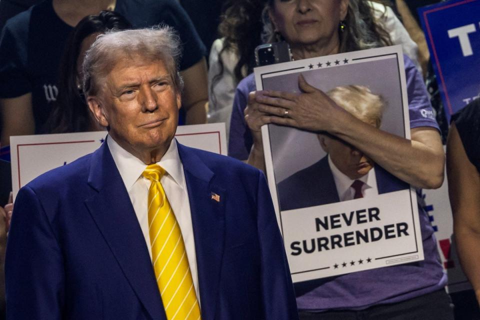 Trump looks on as he arrives to deliver a campaign speech during a Turning Point USA event at the Dream City Church in Phoenix, Arizona on June 6 (REUTERS)