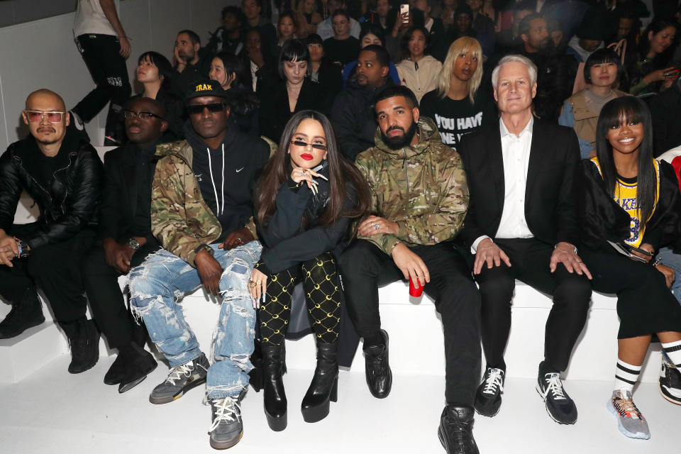 NEW YORK, NEW YORK - FEBRUARY 05:(L - R) Edward Enninful, Virgil Abloh, Rosalia, Drake, John Donahoe, and Gabby Douglas attend the 2020 Tokyo Olympic collection fashion show at The Shed on February 05, 2020 in New York City. (Photo by Bennett Raglin/Getty Images)