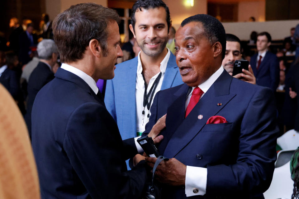 FILE - French President Emmanuel Macron, let, speaks with President of the Republic of the Congo Denis Sassou Nguesso at the New Global Financial summit in Paris Thursday, June 22, 2023. The era of France's arm-twisting interventionism in Africa may finally be over. France has sat by militarily despite moves by putschists to seize control of former French colonies in recent years. (Ludovic Marin, Pool via AP, File)