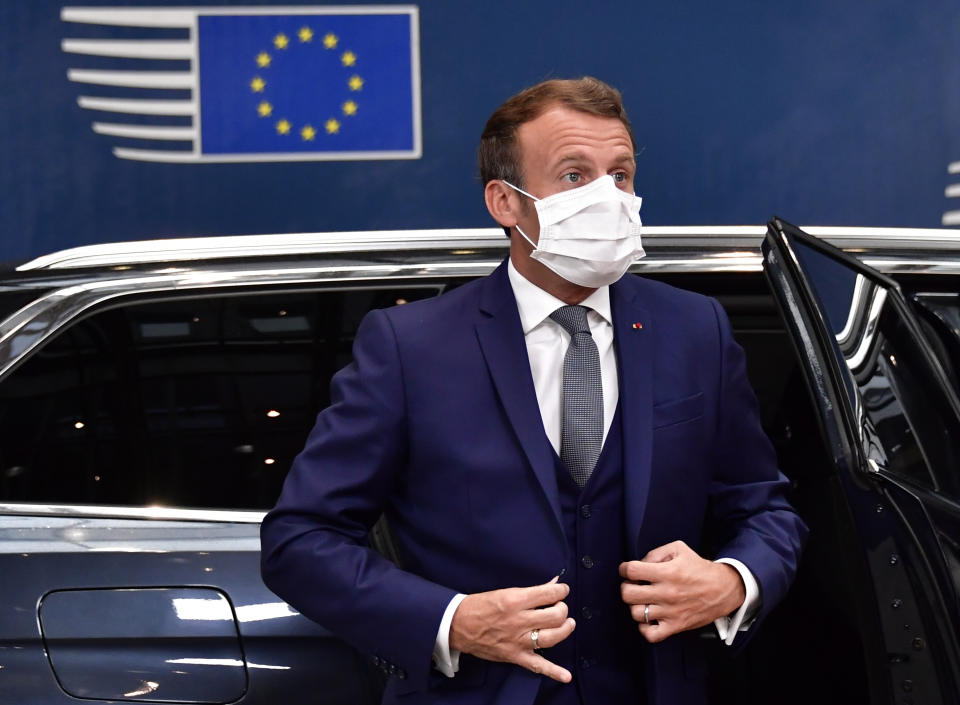 France's President Emmanuel Macron wearing facemask arrives for a European Union Council in Brussels on July 17, 2020, the leaders of the European Union hold their first face-to-face summit over a post-virus economic rescue plan. - The EU has been plunged into a historic economic crunch by the coronavirus crisis, and EU officials have drawn up plans for a huge stimulus package to lead their countries out of lockdown. (Photo by JOHN THYS / POOL / AFP) (Photo by JOHN THYS/POOL/AFP via Getty Images)