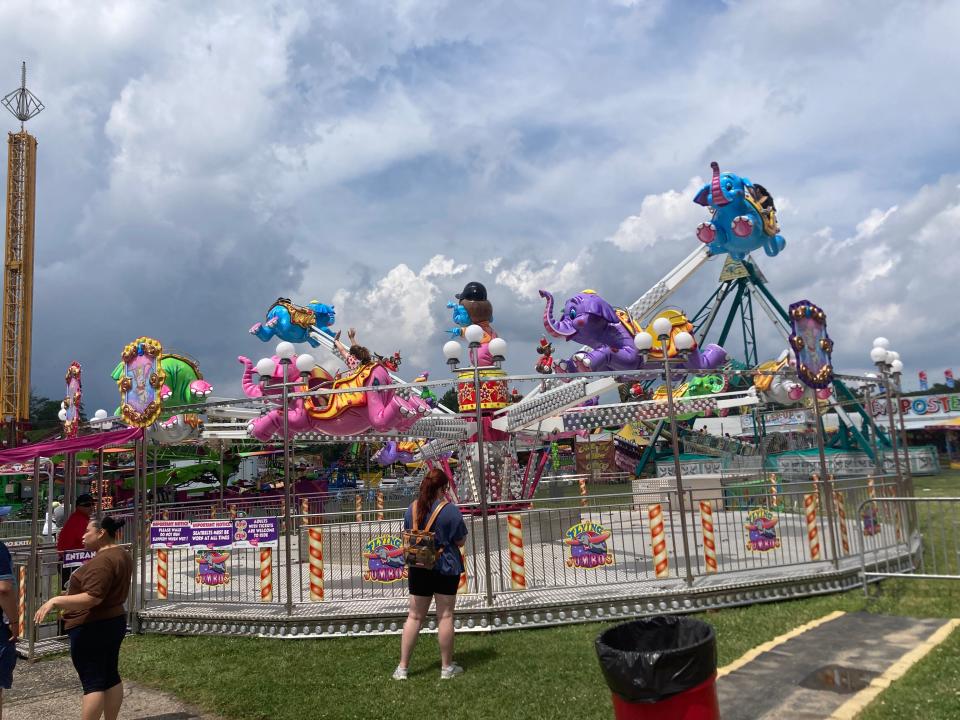 People ride the Dumbo elephant carousel at the St. Joseph County 4-H Fair in South Bend.