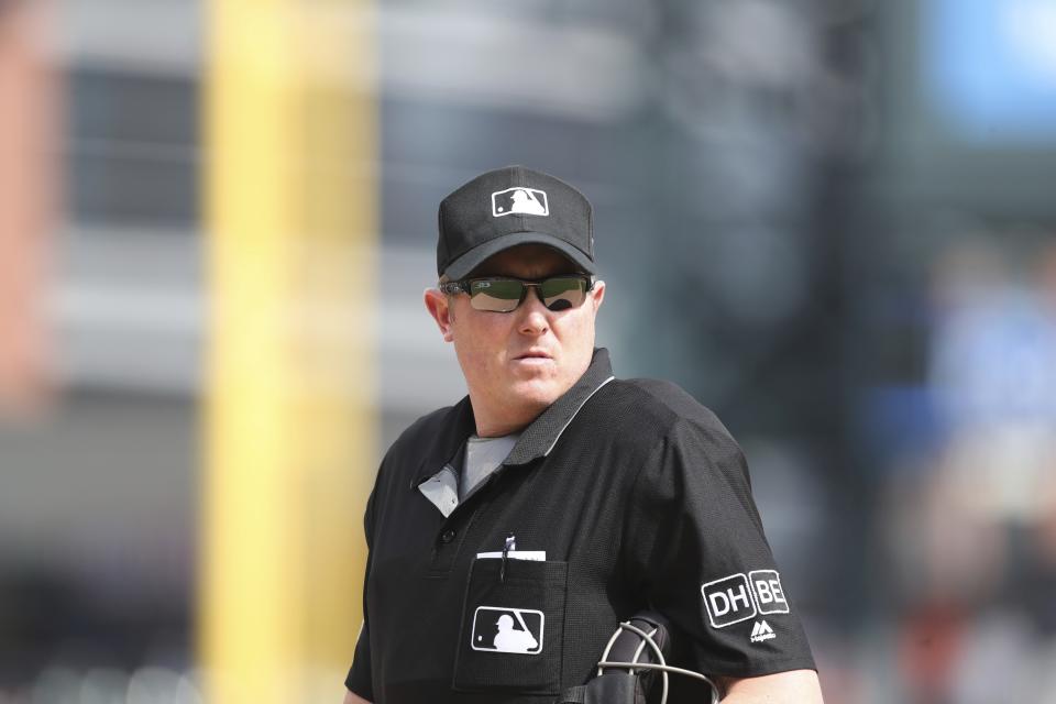 FILE - In this May 2, 2018 file photo home plate umpire Chad Whitson is seen during the tenth inning of a baseball game between the Detroit Tigers and the Tampa Bay Rays in Detroit. Whitson will replace Mike DiMuro, who is retiring after two decades as an umpire, the commissioner’s office said Thursday, July 18, 2019. (AP Photo/Carlos Osorio, file)