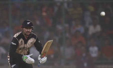 Cricket - England v New Zealand - World Twenty20 cricket tournament semi-final - New Delhi, India - 30/03/2016. New Zealand's Colin Munro watches the ball after playing a shot. REUTERS/Adnan Abidi