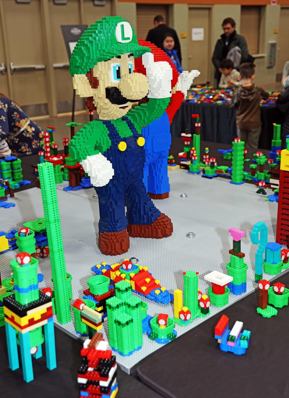 Luigi welcomes guests at Brick Fest Live featuring life-sized models made from Legos, hands-on activities, and a meet-and-greet with Manny from the "Lego Masters" TV show at the Iowa Events Center in Des Moines on Saturday, Feb. 17, 2024.