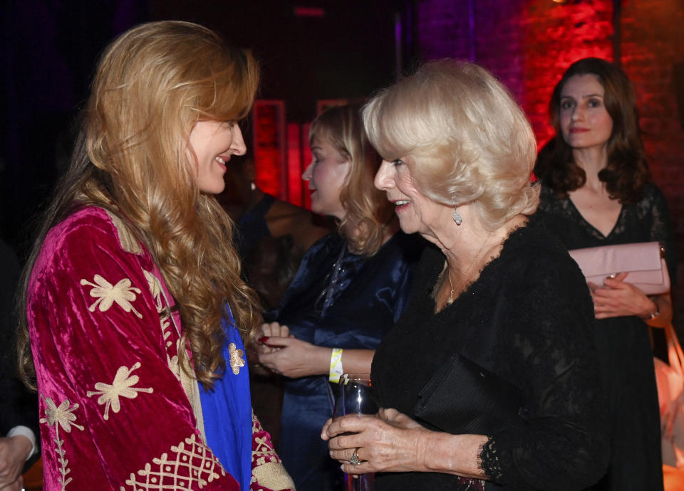 Britain's Camilla, Queen Consort, meets actor Natascha McElhon during the Booker Prize at the Roundhouse in London, Monday Oct. 17, 2022. (Toby Melville/Pool via AP)
