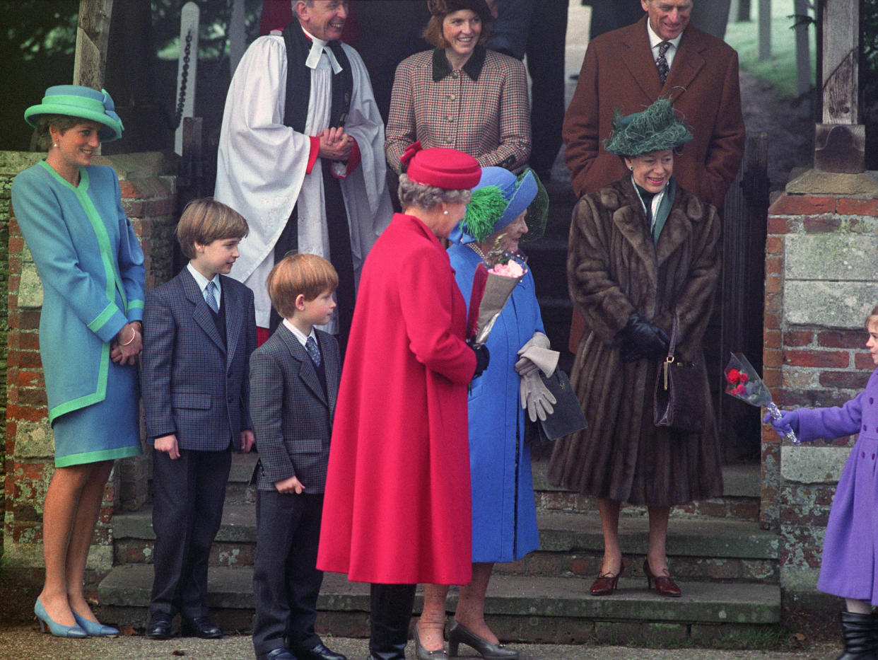 The Queen Mother is presented with a bouquet after attending a Christmas morning service at Sandringham Church. With the Queen Mother are (l-r) Diana, Princess of Wales, Prince William, Prince Harry, Queen Elizabeth II and Princess Margaret. (Photo by Martin Keene/PA Images via Getty Images)