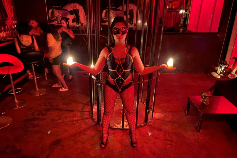 Fetish show performer May performs at the BarBar fetish bar in Patpong nightlife district in Bangkok