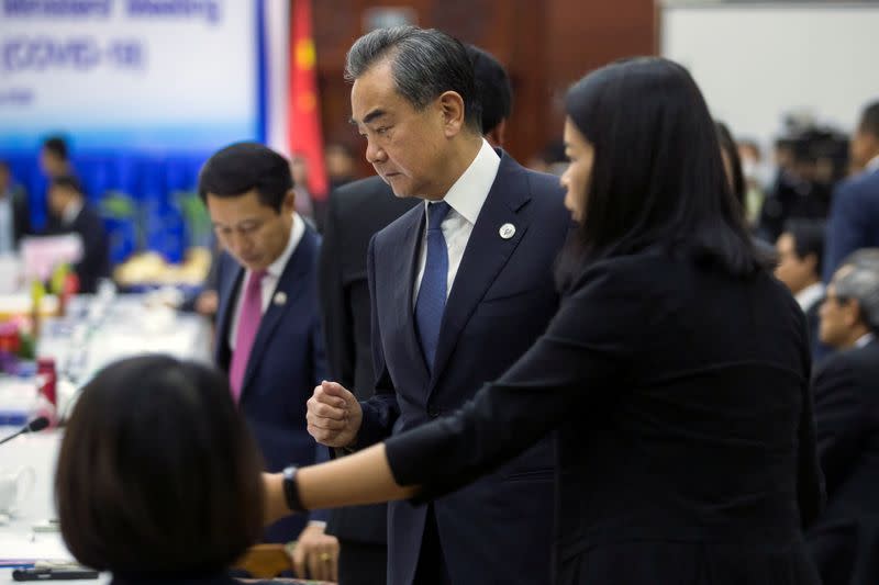 China's Foreign Minister Wang arrives to meeting with foreign ministers of ASEAN on coronavirus outbreak in Vientiane