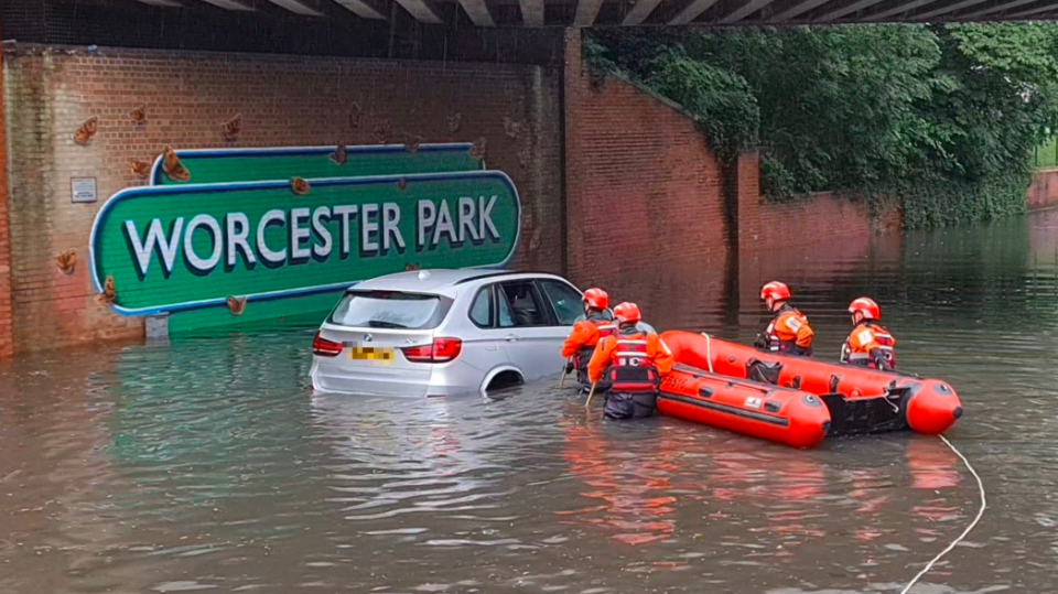 Firefighters rescued a family which became trapped in their car in Worcester Park (LFB)