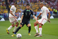 From left Tunisia's Ellyes Skhiri, Australia's Mathew Leckie and Tunisia's Wahbi Khazri vie for the ball during the World Cup group D soccer match between Tunisia and Australia at the Al Janoub Stadium in Al Wakrah, Qatar, Saturday, Nov. 26, 2022. (AP Photo/Ebrahim Noroozi)