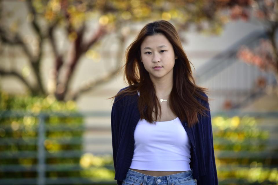 Yena Choe, Leonia HS senior, who has been calling her relatives since the Halloween tragedy took place in Seoul, poses for a photo, outside of her apartment complex in Edgewater, Sunday on 10/30/22.