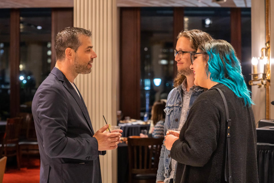 Detroit Symphony Orchestra music director Jader Bignamini, left, chats with new DSO subscribers Ken Keel and Jessie Nielson at a post-concert reception on May 6, 2023.