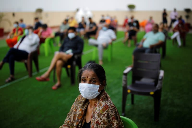 Patients suffering from the coronavirus disease (COVID-19) attend an evening buffet at a terrace at a hospital in Noida