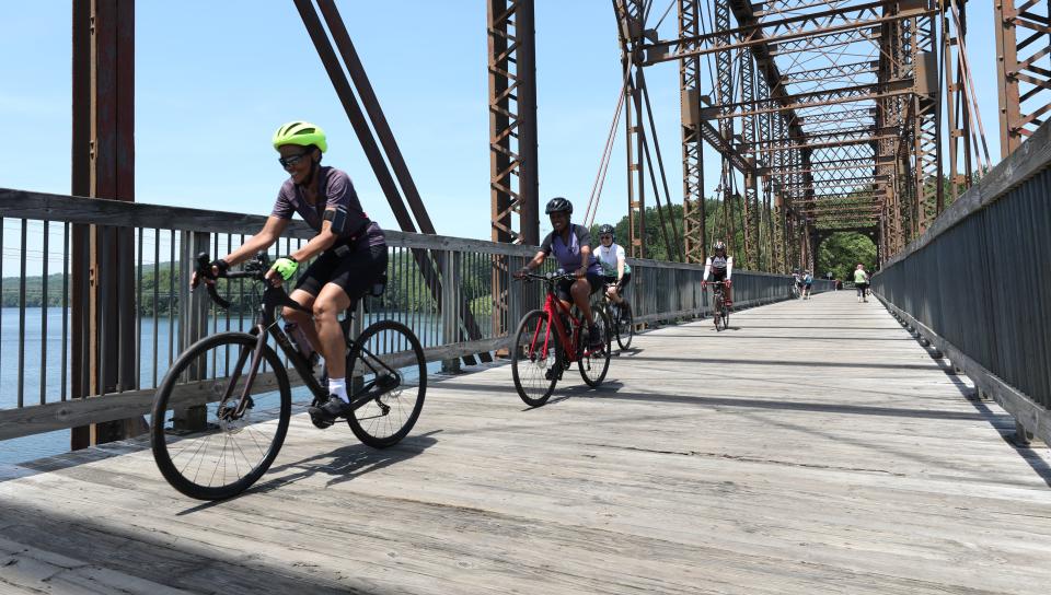 Cyclists and pedestrians on the North County Trailway, cross the bridge over the Croton Reservoir near Route 118 in Yorktown, June 5, 2021. 