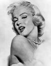 <p>Marilyn’s perfect pin-up girl curls were *the* most talked about locks in the 50s. <em>[Photo: PA]</em> </p>