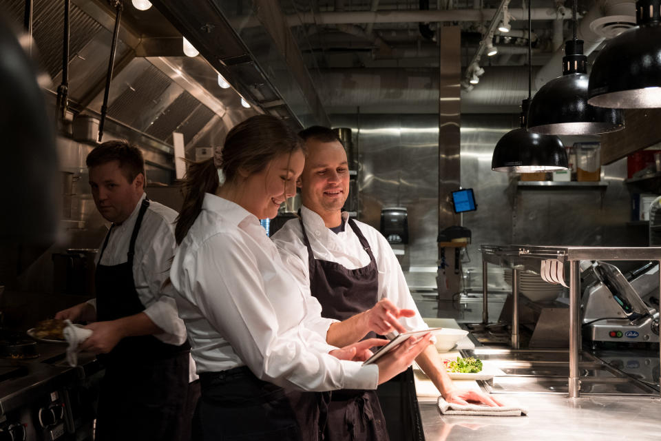 two people in a kitchen