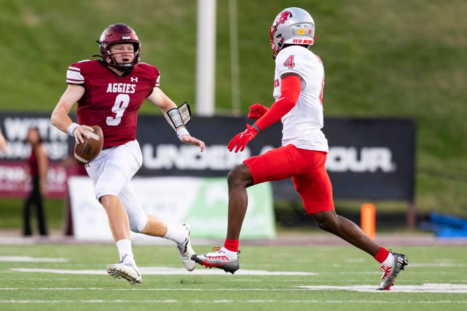 NMSU quarterback Gavin Frakes runs the ball during the NMSU v. UNM football game on Saturday, Oct. 15, 2022, at Aggies Memorial Stadium.