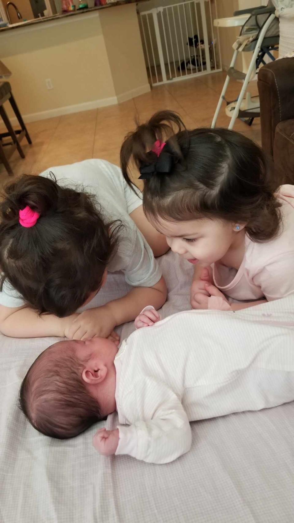 Jasmine and Jessica with their baby sister Juliet. The Turner family has three girls all born on Sept. 3 within four years.