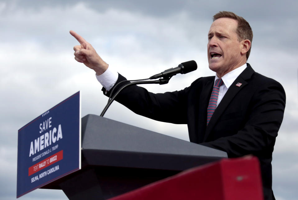 FILE - Republican candidate for U.S. Senate, Rep. Ted Budd, R-N.C., addresses a crowd before former President Donald Trump speaks at a rally, April 9, 2022, in Selma, N.C. Budd is leaning into support for abortion restrictions and amity for the former Republican president as Democrats fight for an elusive victory in the Southern swing state. Budd is set to appear alongside Trump, Friday, Sept. 23, 2022, at a rally in Wilmington, N.C. (AP Photo/Chris Seward, File)