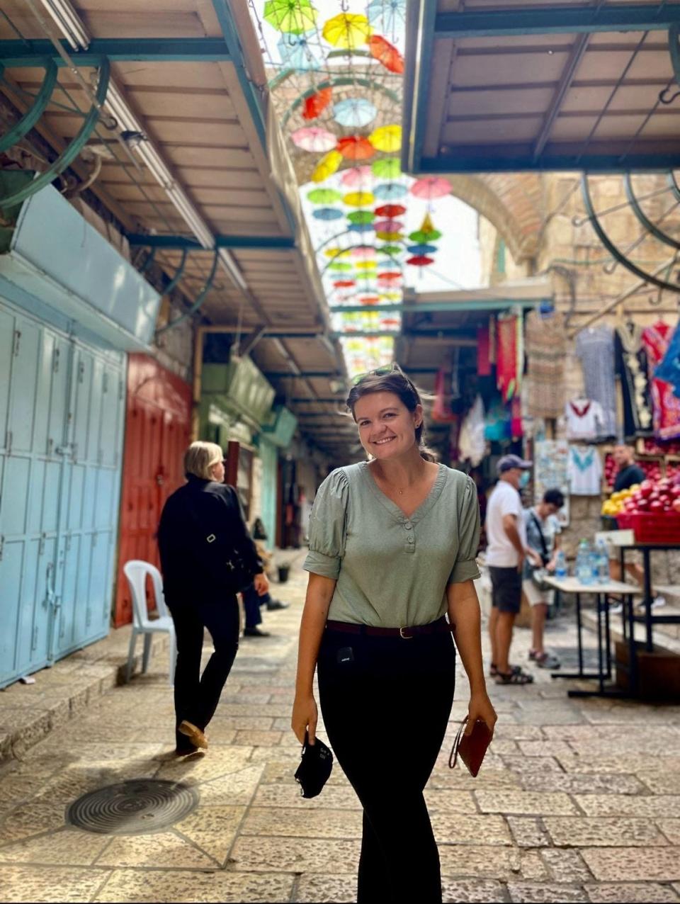 Maddi Froiland, a Whitefish Bay native who lives and works around Bethlehem in the West Bank, poses for a photo in nearby Jerusalem in September 2021. She works for the Evangelical Lutheran Church in Jordan and the Holy Land, which operates schools and churches across the region.