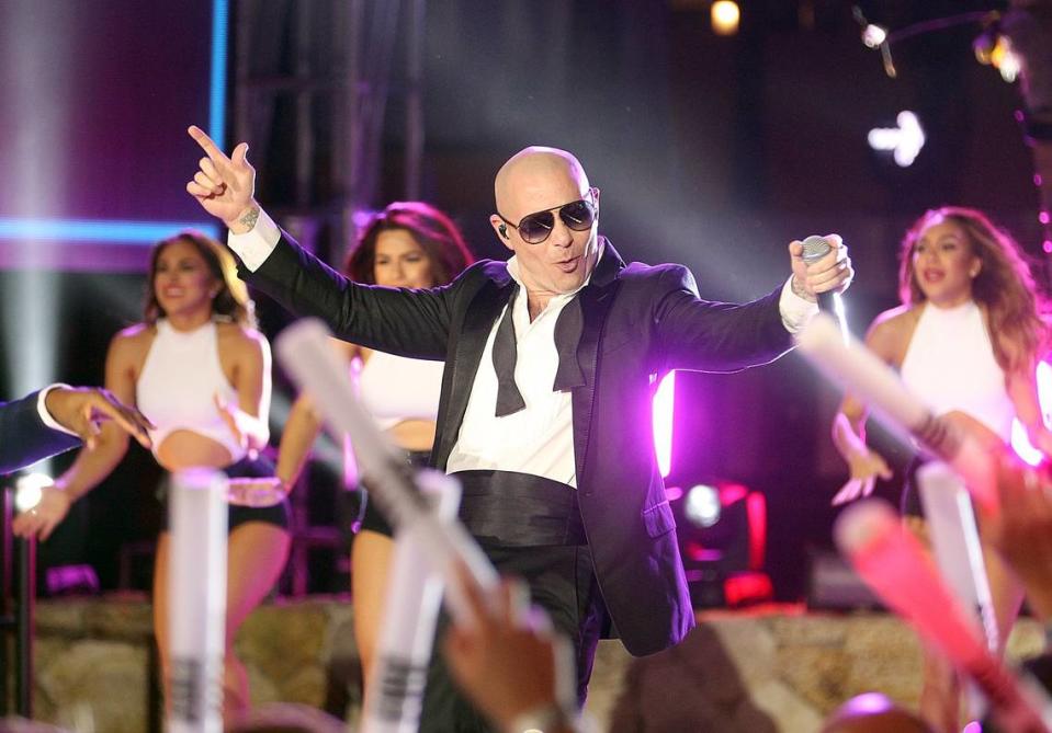 Pitbull, Mr. 305, performs in the 305 in November 2018 at the American Airlines Arena. The Miami rapper will have to share space with another area code handle when 645 joins 305 and 786 in Miami-Dade and the Keys on Aug. 4, 2023.